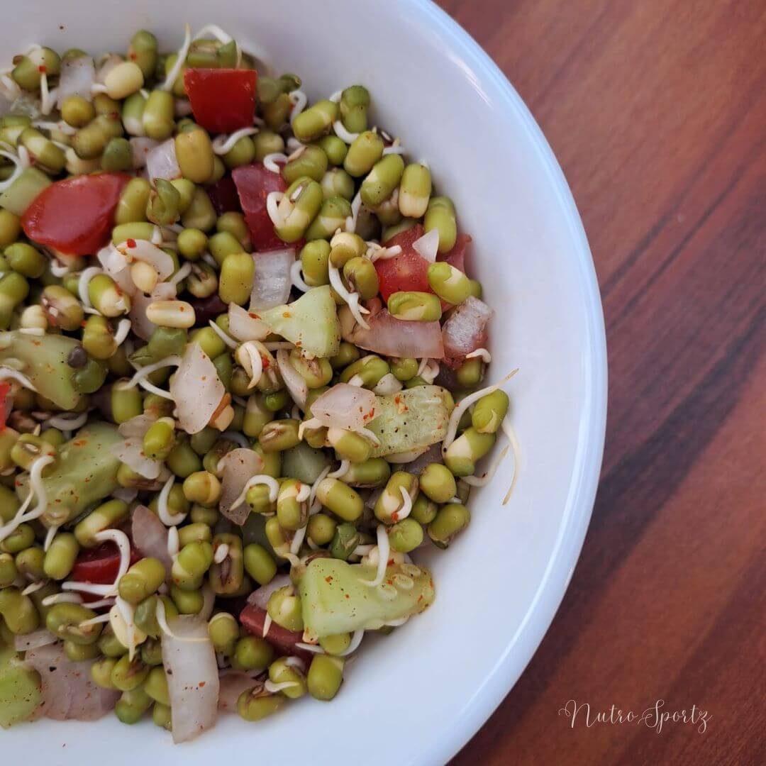 An image of moong dal sprouts salad- classic version in a bowl.