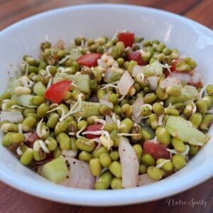 An image of moong dal sprouts salad in a bowl.