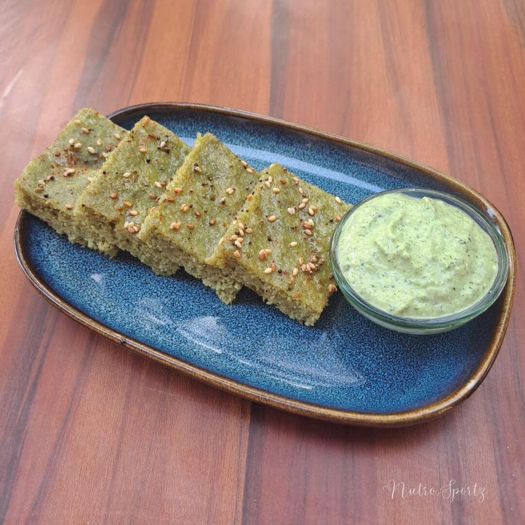 An image of moong dal dhokla on a plate.