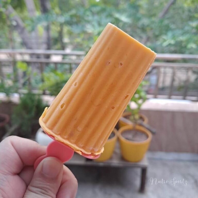 An image of mango frozen yogurt popsicle.