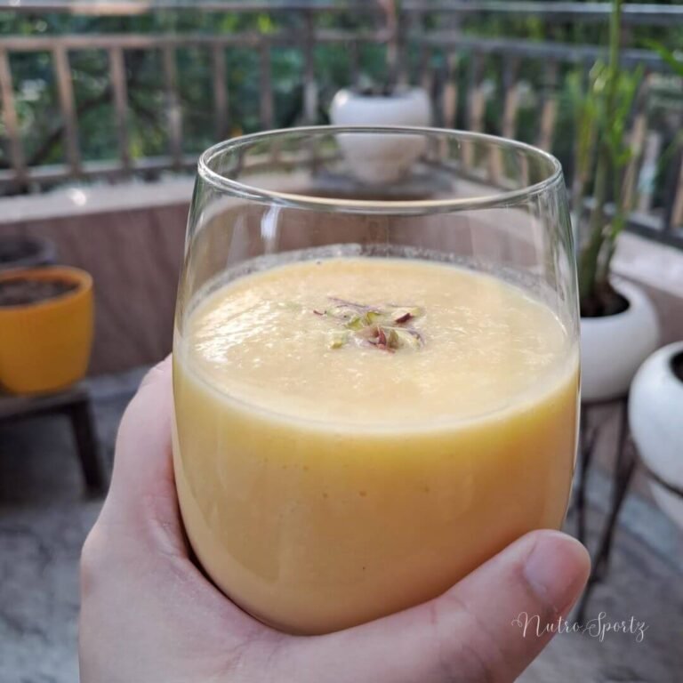 An image of mango milkshake in a glass.