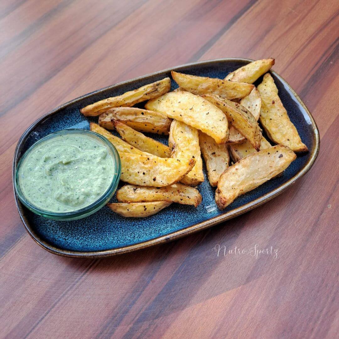 An image of baked potato wedges on a plate.